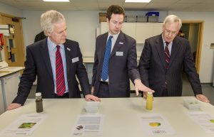 Gerald-McDonald, Maxim McDonald and HRH Duke of Gloucester looking at Yuzu juice